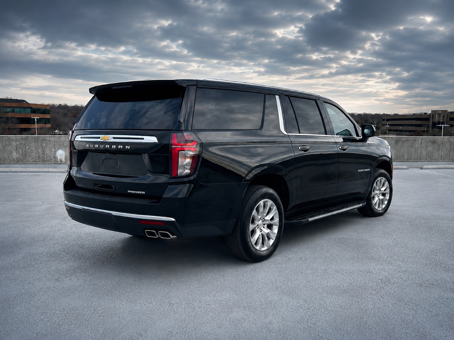 Black Chevrolet Suburban Premier, rear three-quarter view